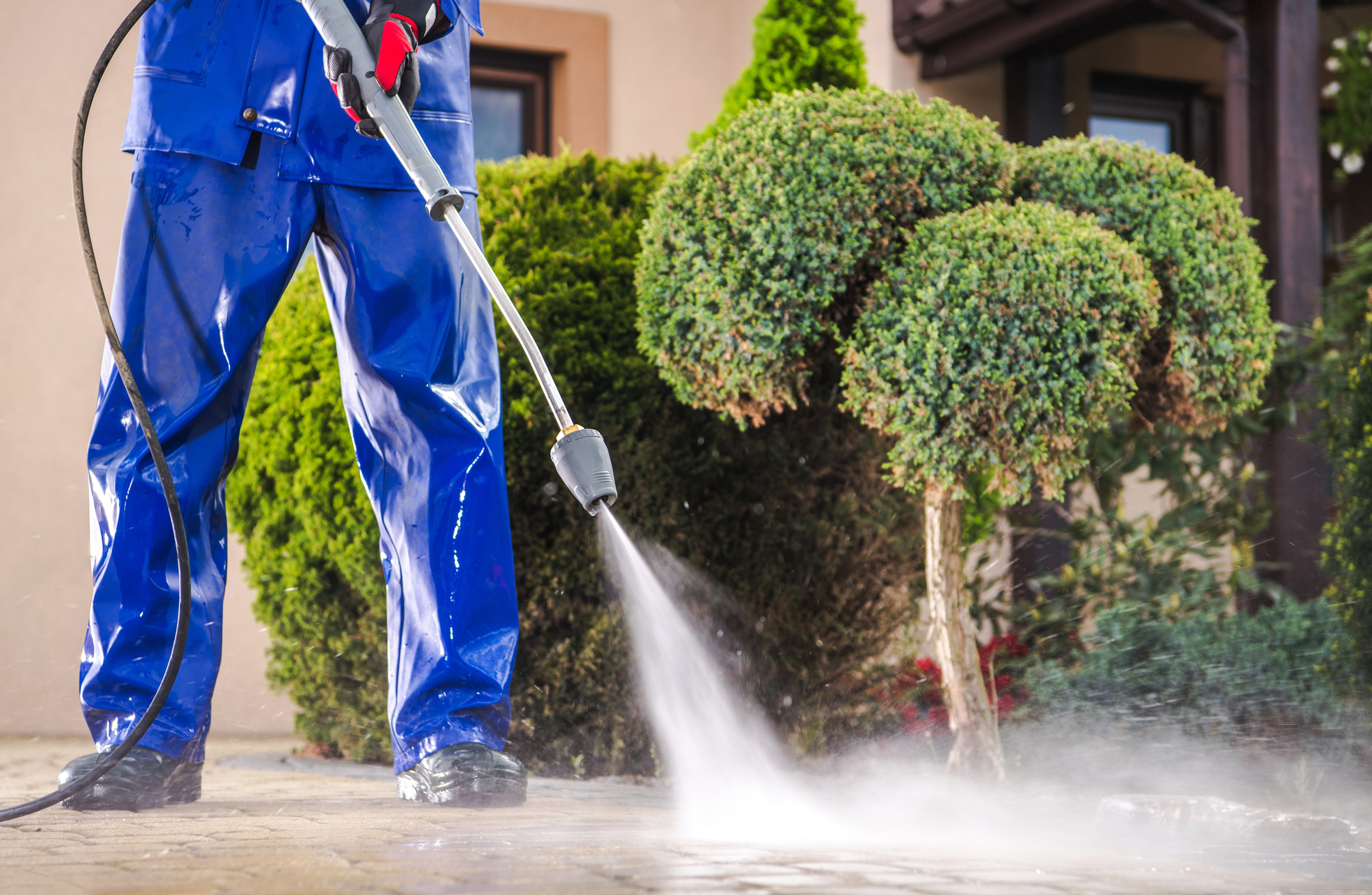 Pressure Washer Cleaning Residential Driveway