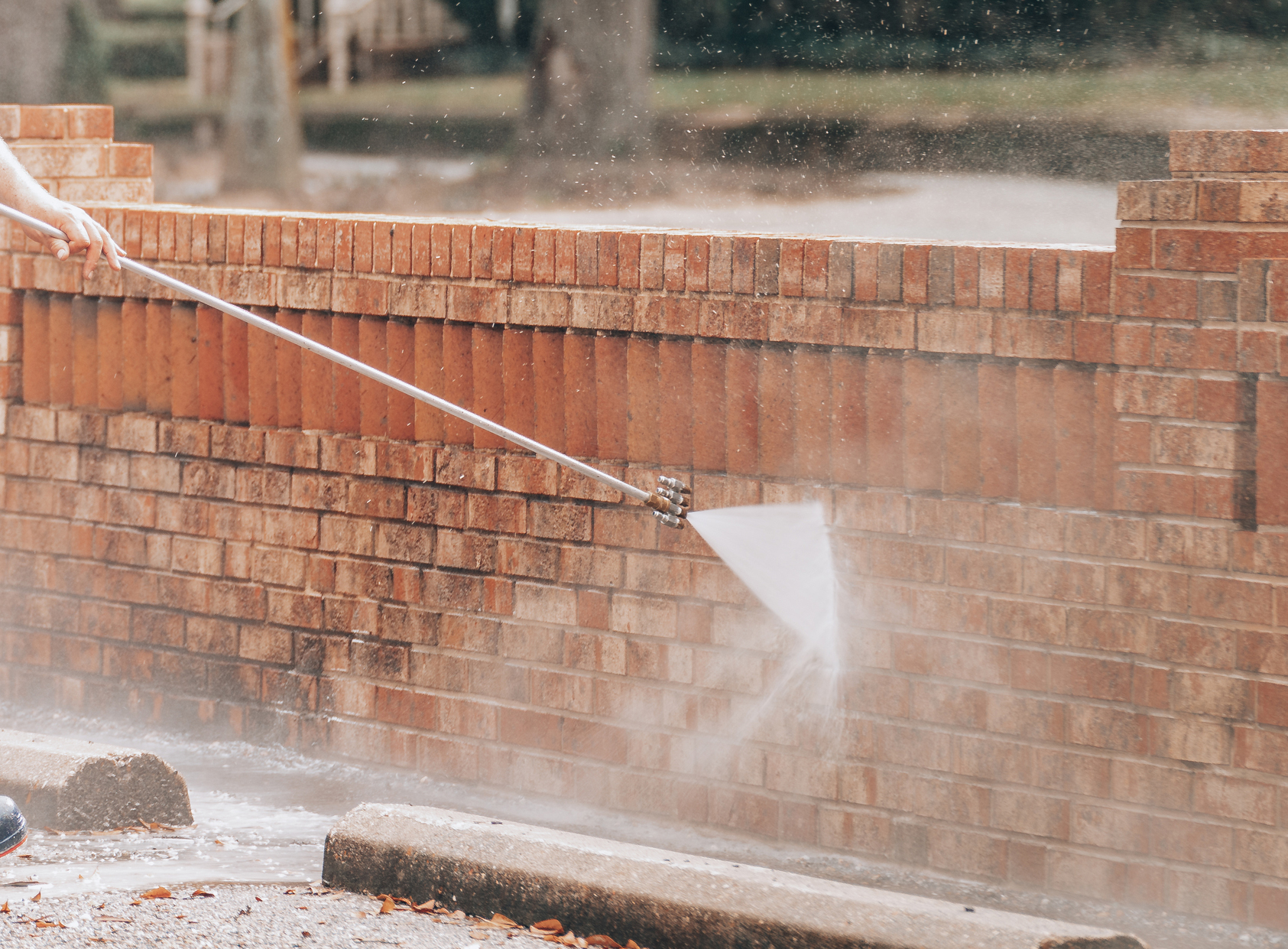 Pressure washing close up brick soft washing